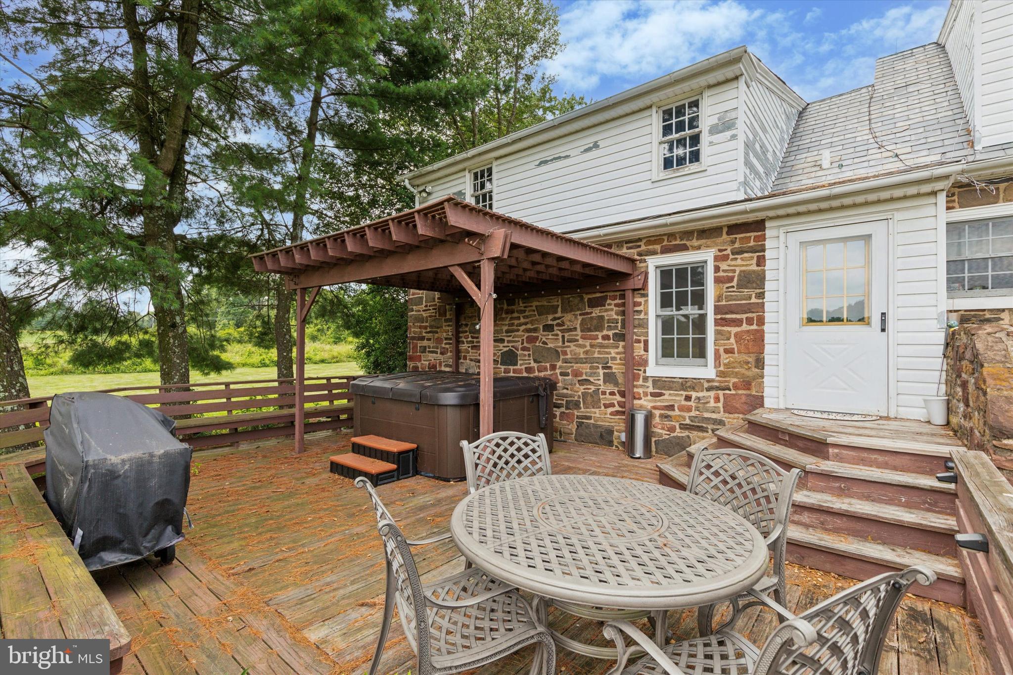 423 Deep Run Road Perkasie, PA 18944 - Photo 18 of 25 a patio with wooden table and chairs