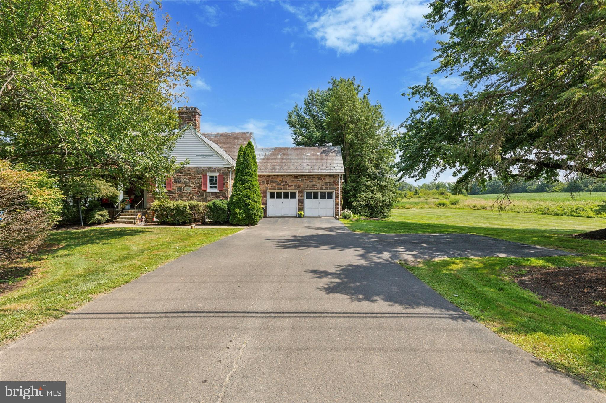 423 Deep Run Road Perkasie, PA 18944 - Photo 2 of 25 a front view of a house with garden