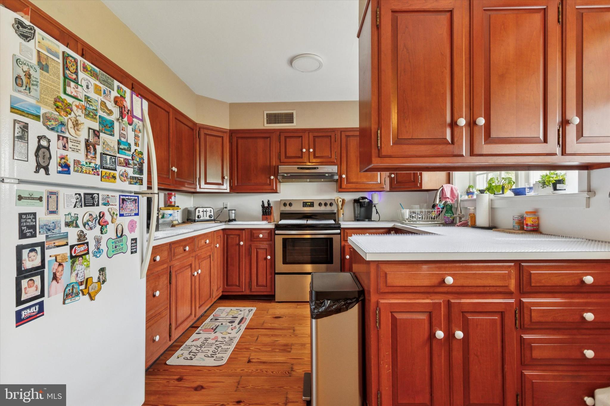 423 Deep Run Road Perkasie, PA 18944 - Photo 8 of 25 a kitchen with stainless steel appliances a stove a sink and a microwave
