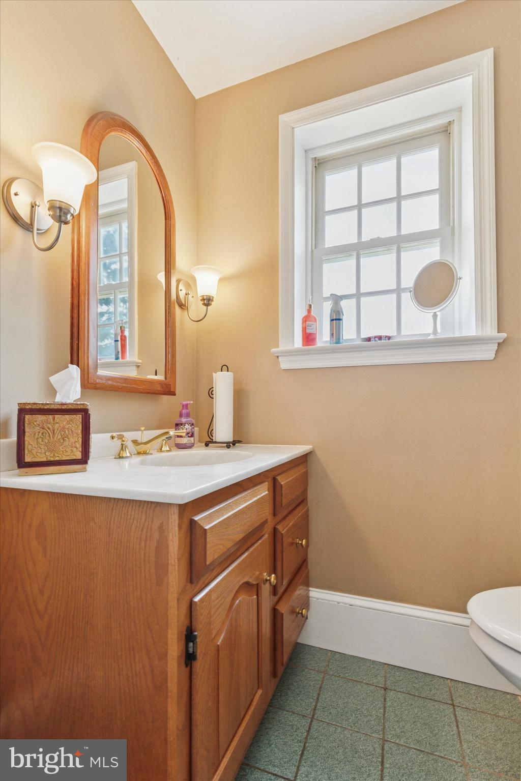 423 Deep Run Road Perkasie, PA 18944 - Photo 10 of 25 a bathroom with a sink a mirror and a window