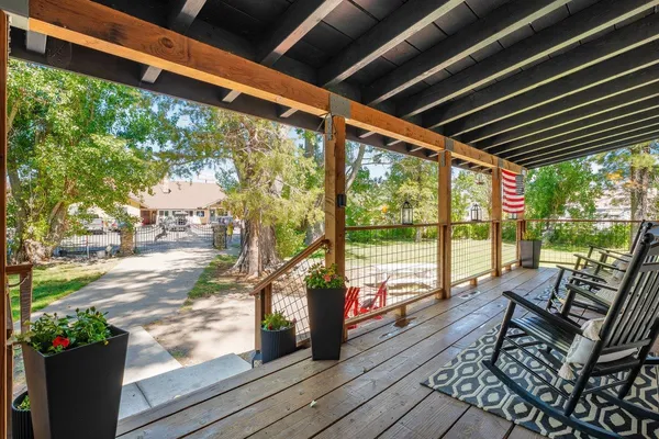 a view of porch with wooden floor