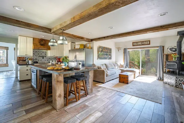 a kitchen with a table chairs and a window