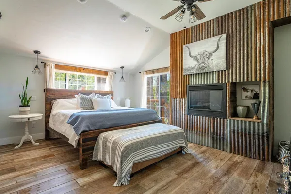 a room with a table chairs and a wooden floor