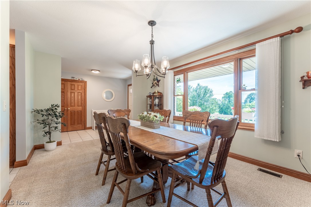 20 Reedsburg Road Wooster, OH 44691 - Photo 15 of 42 Carpeted dining area with a chandelier