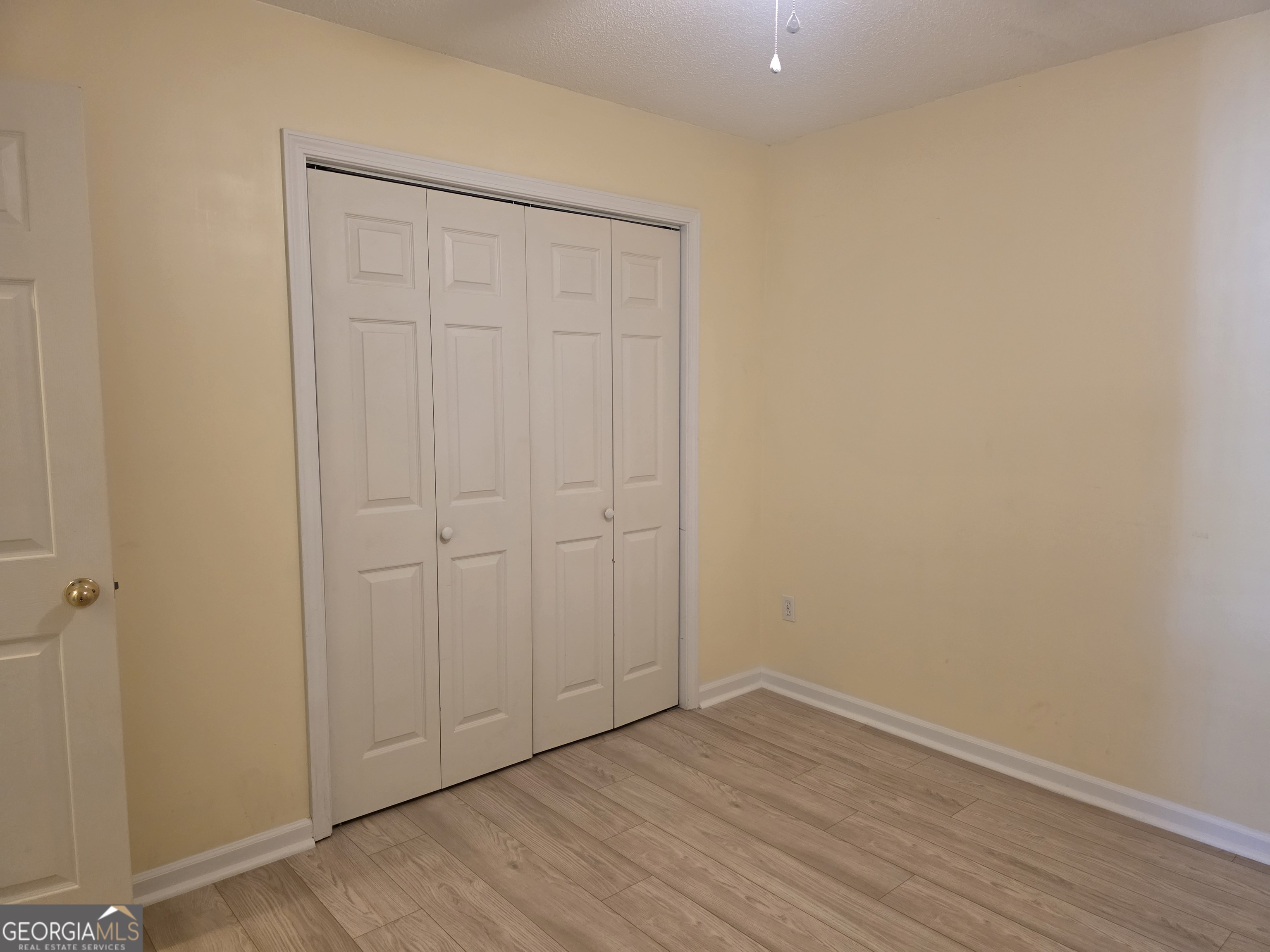 136 Towne Park Drive West Rincon, GA 31326 - Photo 11 of 24 a view of an empty room with wooden floor