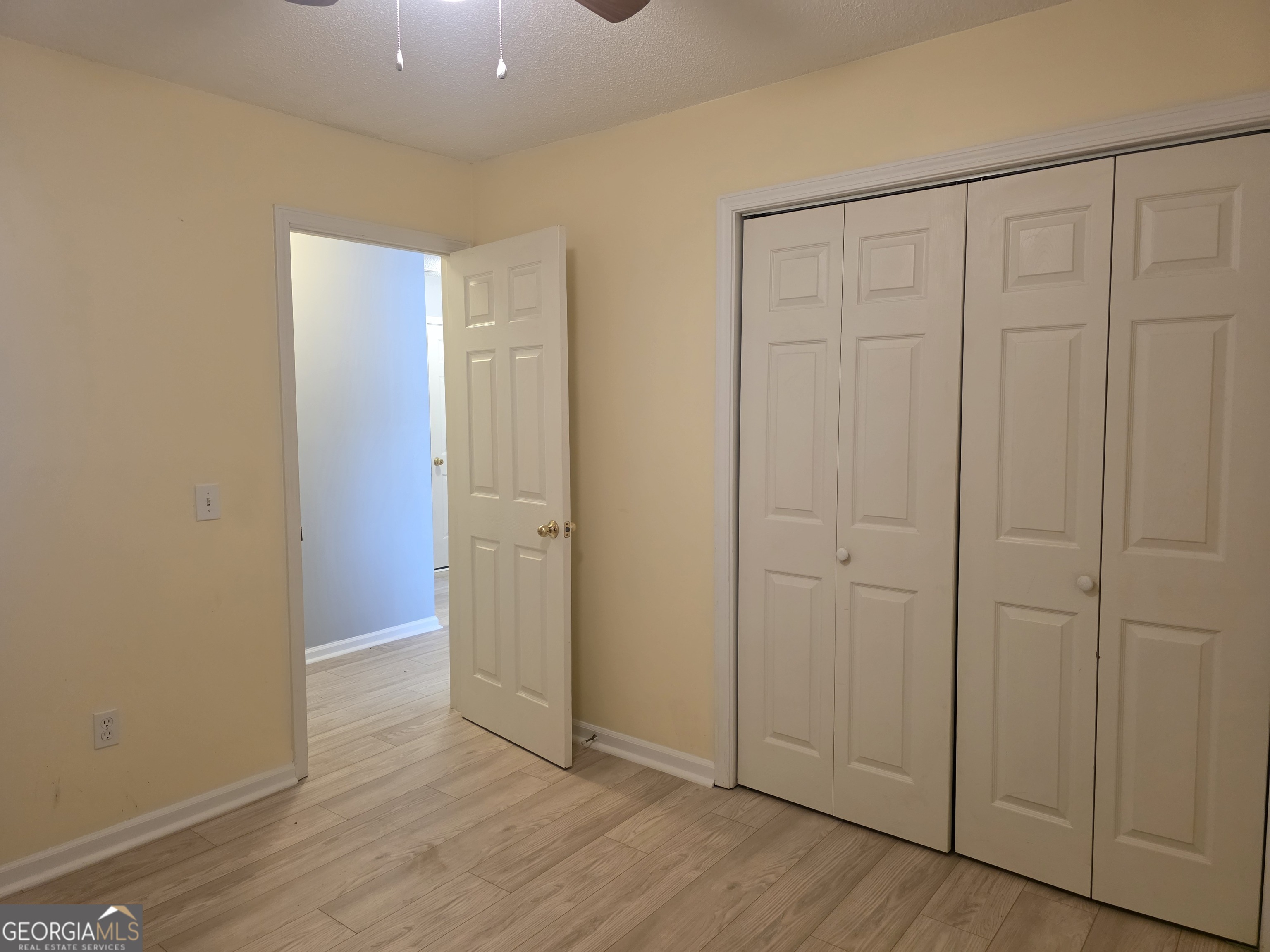 136 Towne Park Drive West Rincon, GA 31326 - Photo 12 of 24 a view of an empty room with wooden floor