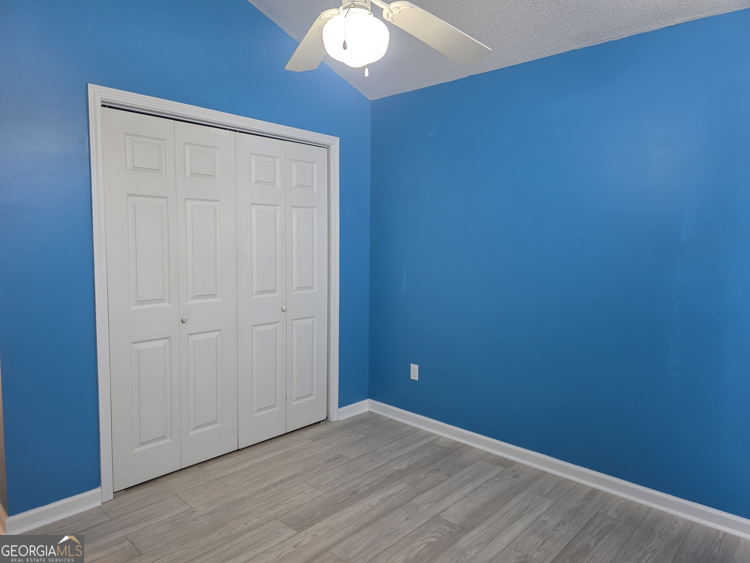 136 Towne Park Drive West Rincon, GA 31326 - Photo 14 of 24 an empty room with wooden floor and windows