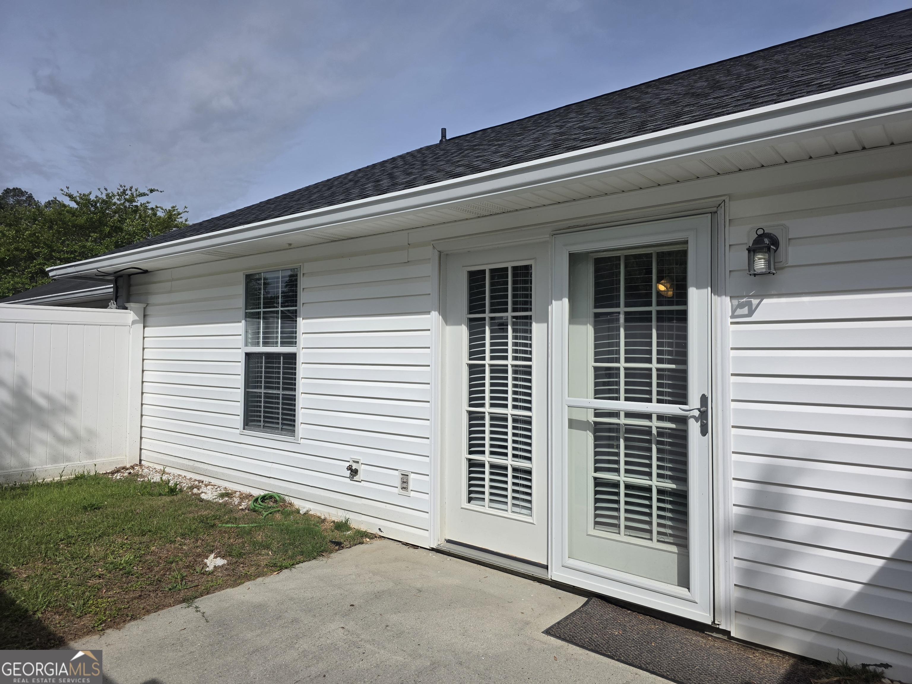 136 Towne Park Drive West Rincon, GA 31326 - Photo 24 of 24 a view of a house with a door and a yard