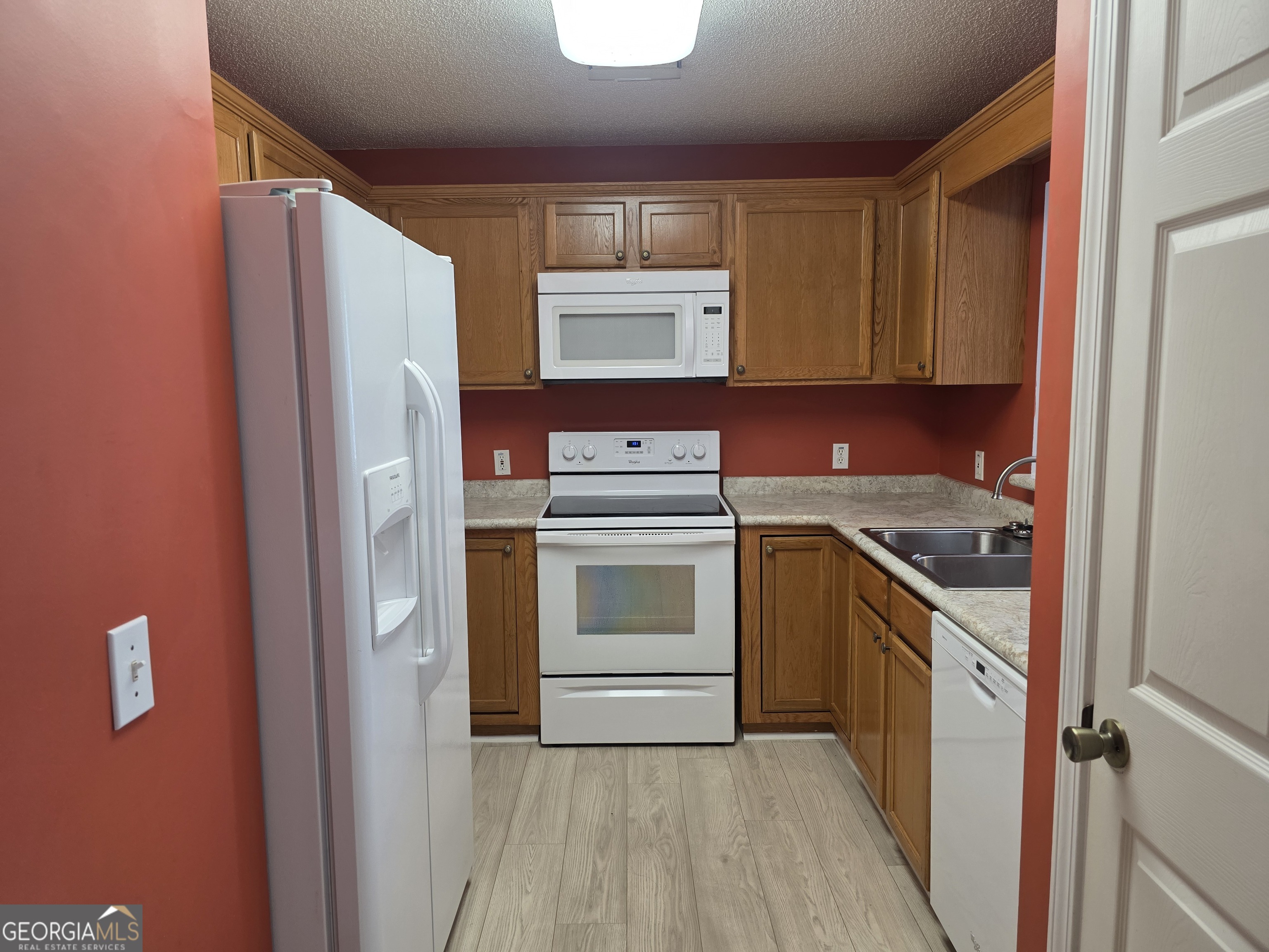 136 Towne Park Drive West Rincon, GA 31326 - Photo 6 of 24 a kitchen with a stove refrigerator and microwave