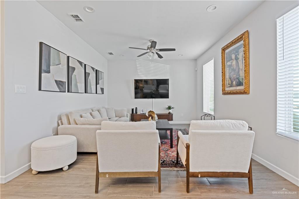 3020 South K Center Street, Unit 2 McAllen, TX 78503 - Photo 2 of 12 a living room with furniture and a flat screen tv