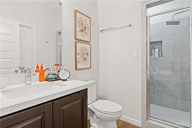 a bathroom with a sink toilet and shower
