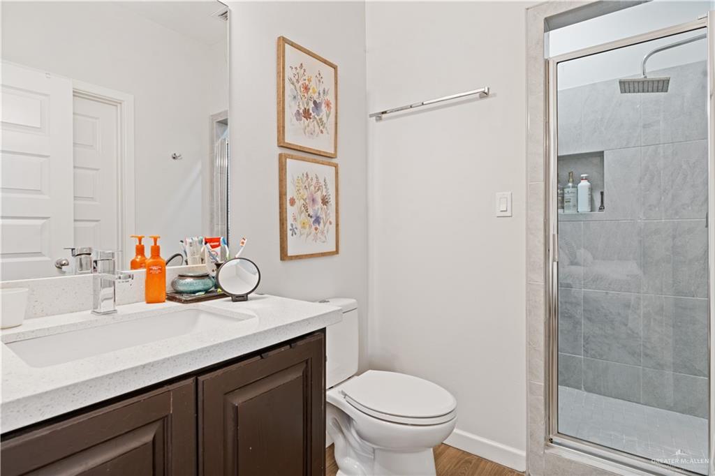 3020 South K Center Street, Unit 2 McAllen, TX 78503 - Photo 9 of 12 a bathroom with a sink toilet and shower