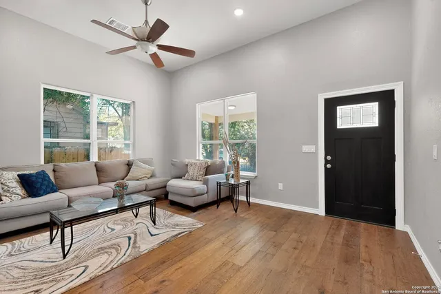 a living room with furniture and a window
