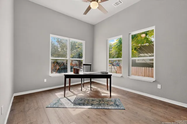 a view of a dining room with furniture window and outside view