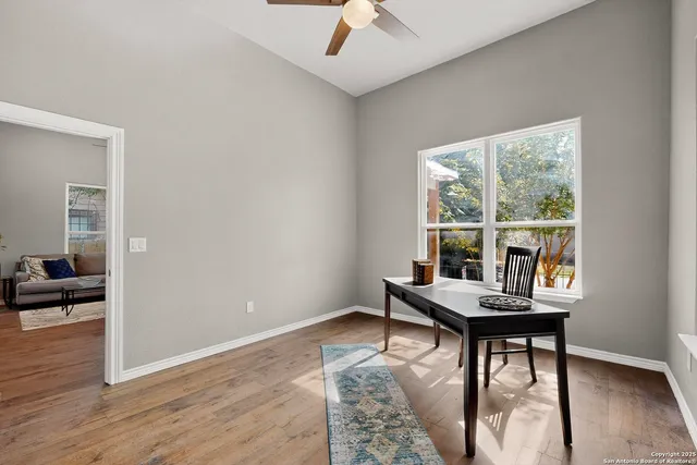 an empty room with sliding door and view of bedroom