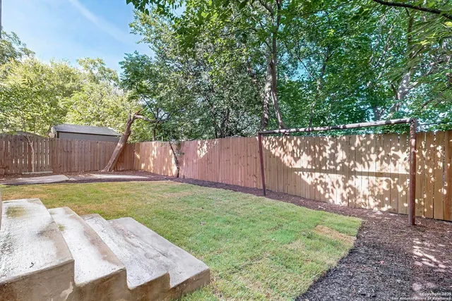 a bathroom with mirror and window