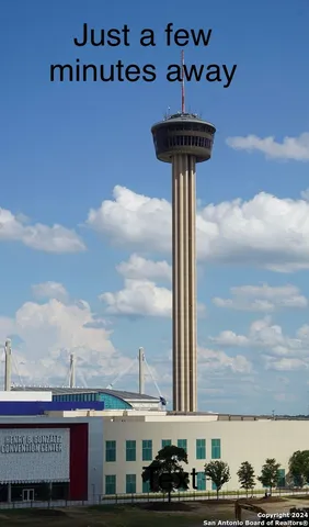 a roof deck with a table and chairs