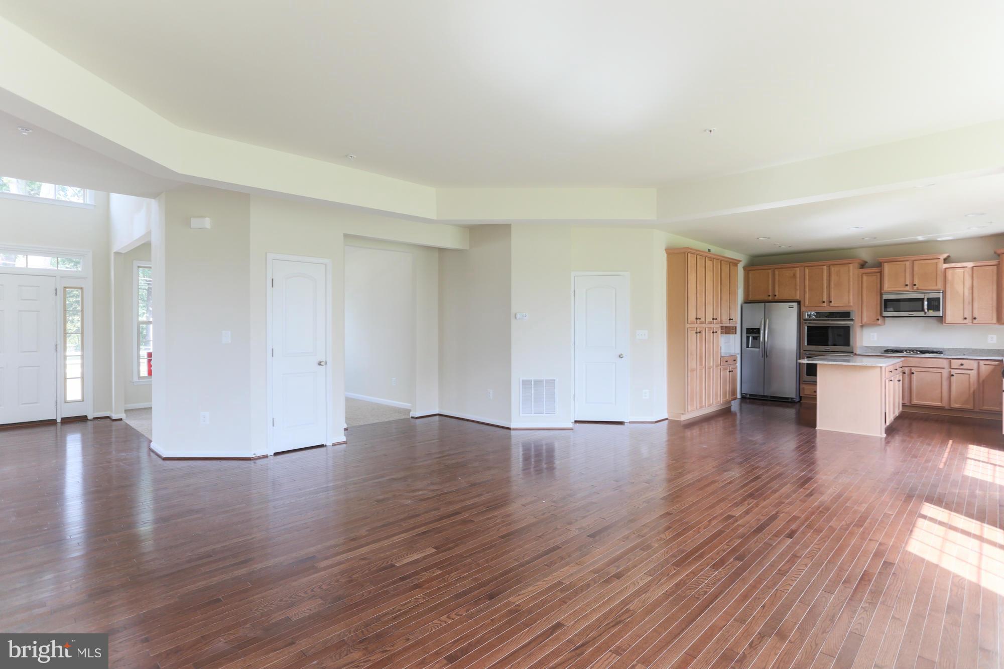 9404 Cross Road Perry Hall, MD 21128 - Photo 11 of 30 a view of a kitchen with wooden floor and a kitchen