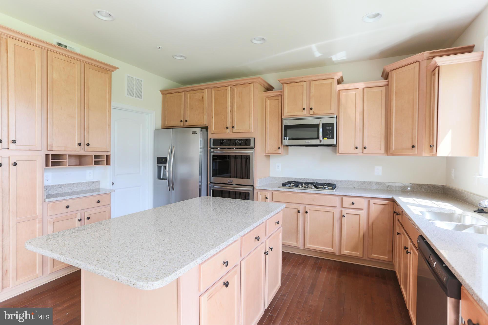 9404 Cross Road Perry Hall, MD 21128 - Photo 15 of 30 a kitchen with a sink stove top oven and refrigerator