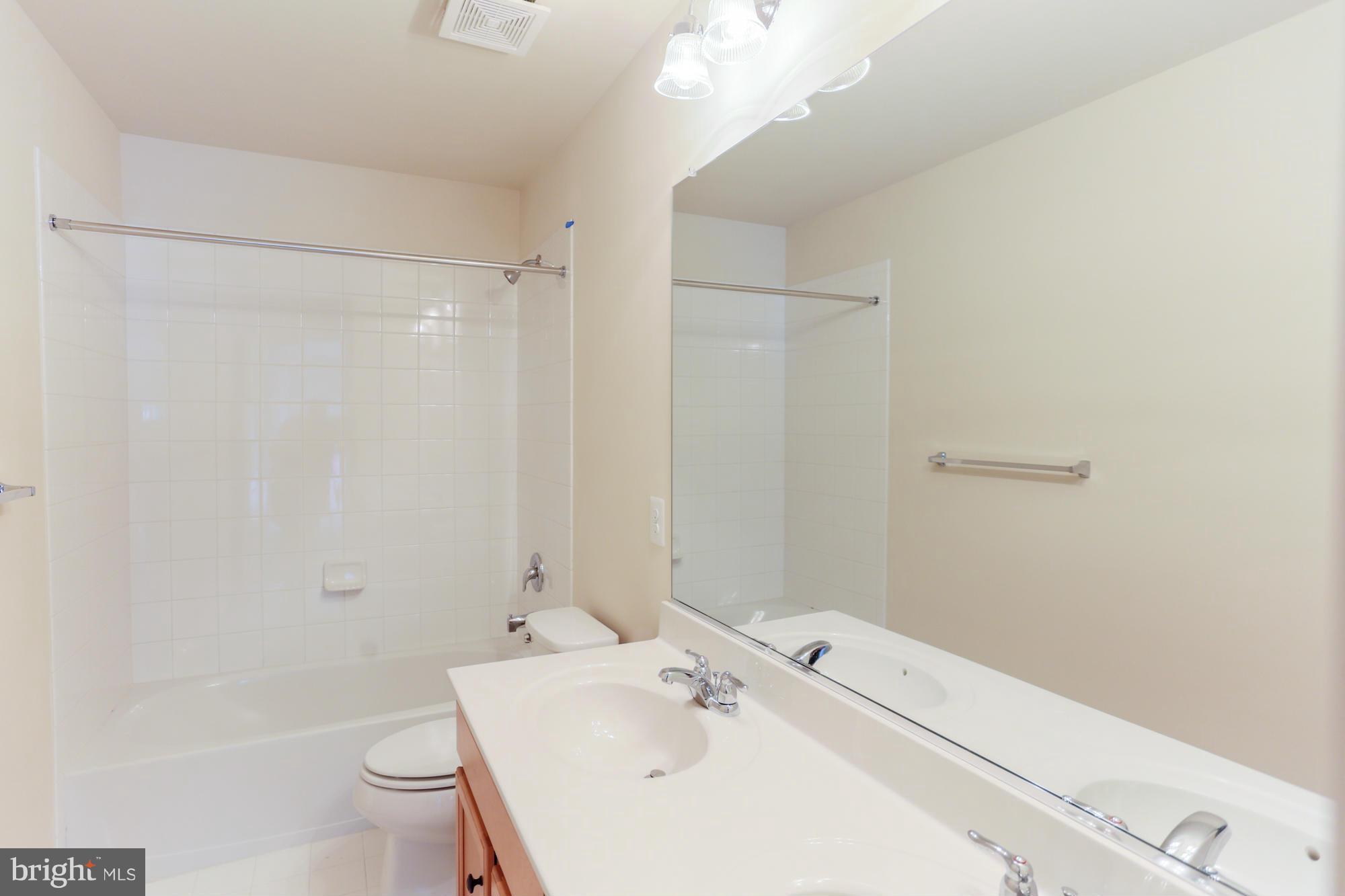 9404 Cross Road Perry Hall, MD 21128 - Photo 24 of 30 a bathroom with a sink a toilet and shower