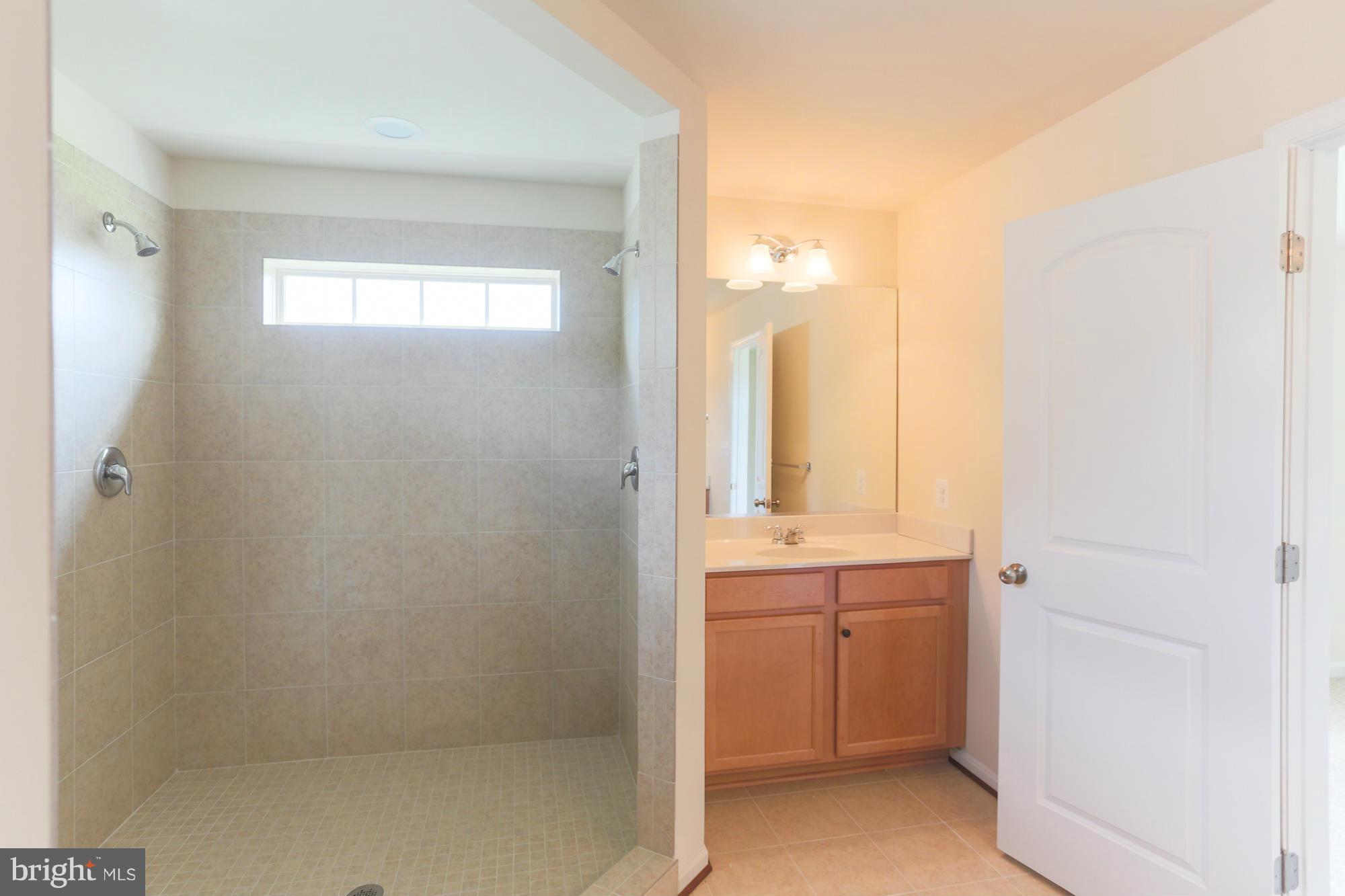 9404 Cross Road Perry Hall, MD 21128 - Photo 29 of 30 a bathroom with a sink a toilet and shower