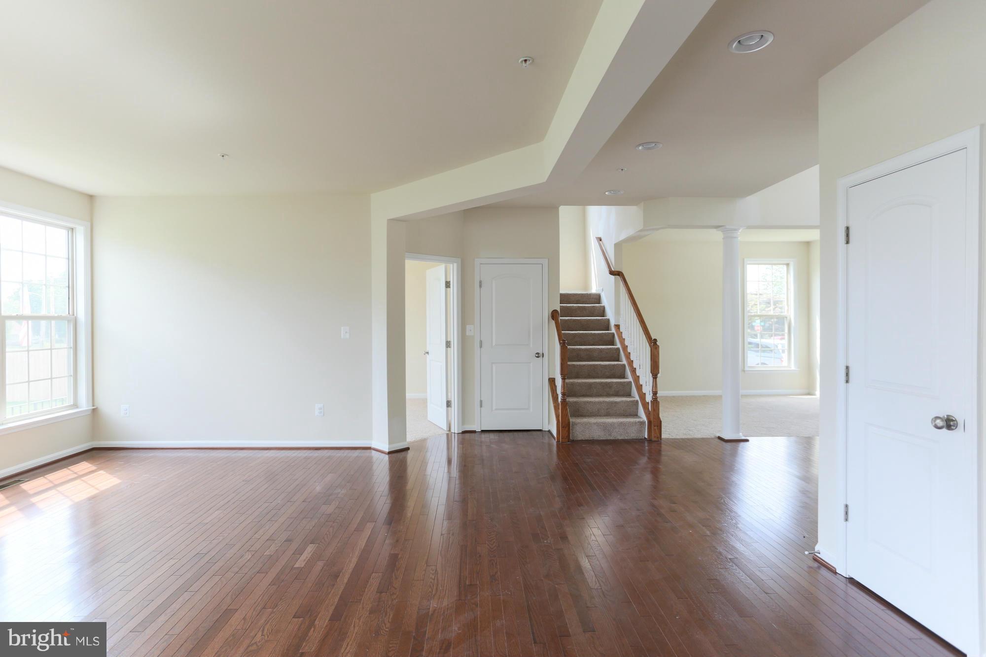 9404 Cross Road Perry Hall, MD 21128 - Photo 9 of 30 wooden floor in an empty room with a window