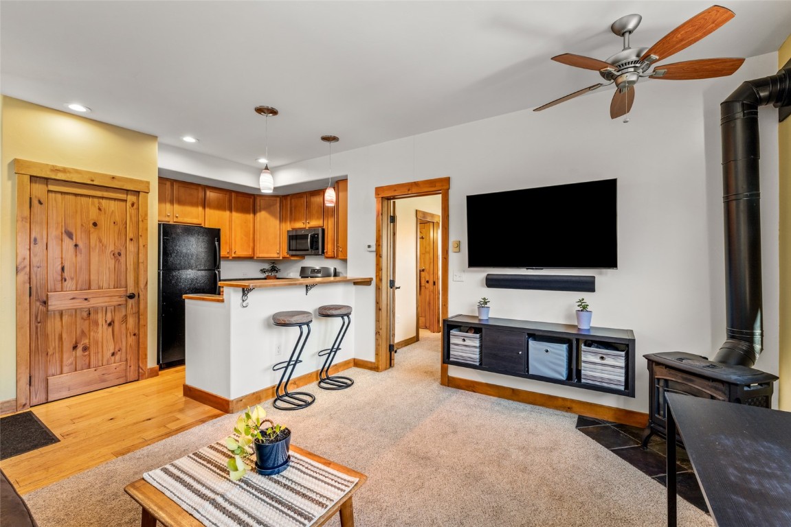 35 11th Street, Unit B Steamboat Springs, CO 80487 - Photo 5 of 18 a view of a livingroom with furniture and a flat screen tv