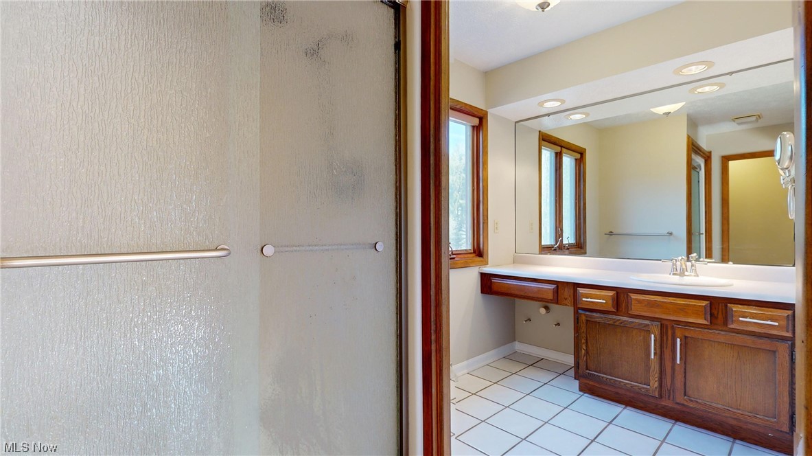 11110 Kile Road Chardon, OH 44024 - Photo 21 of 35 Master Bathroom with oversized vanity and tile floors