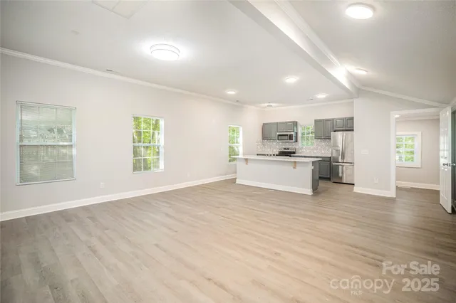 a view of kitchen with wooden floor