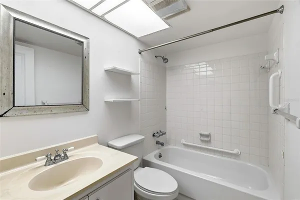 a bathroom with a sink toilet and a bathtub