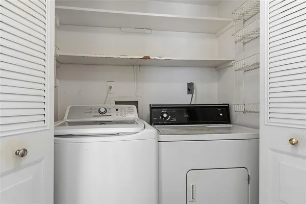 a utility room with dryer and washer