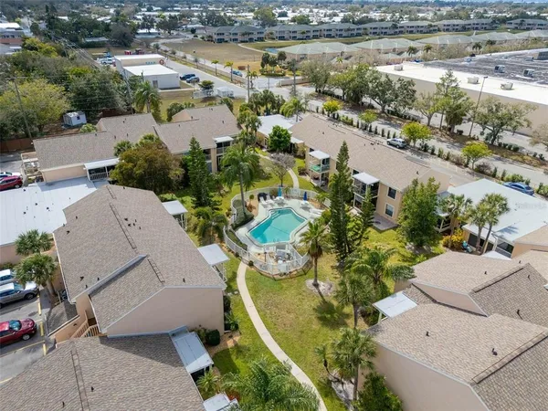 an aerial view of residential houses with outdoor space