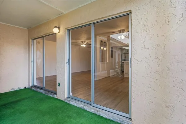 a bathroom with a glass door shower and a sink