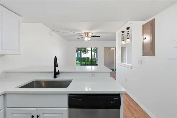 a kitchen with a sink and a window