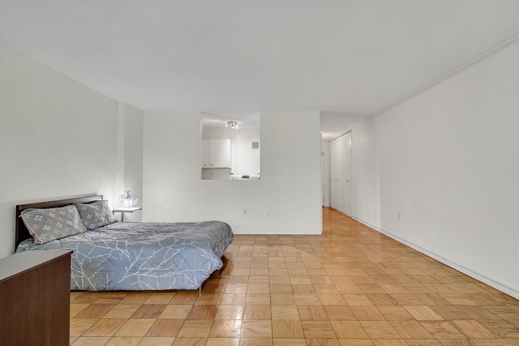9 Hawthorne Place, Unit 5K Boston, MA 02114 - Photo 16 of 37 a living room with a couch and a coffee table