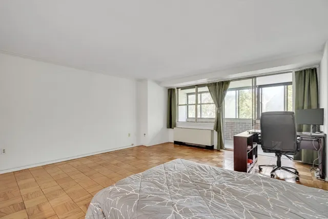 a view of workspace with wooden floor and windows