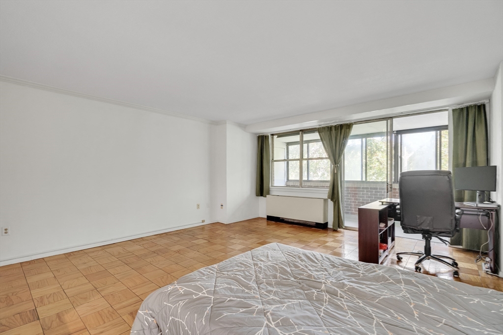 9 Hawthorne Place, Unit 5K Boston, MA 02114 - Photo 18 of 37 a view of workspace with wooden floor and windows