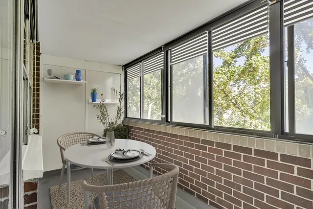 a dining room with furniture and window