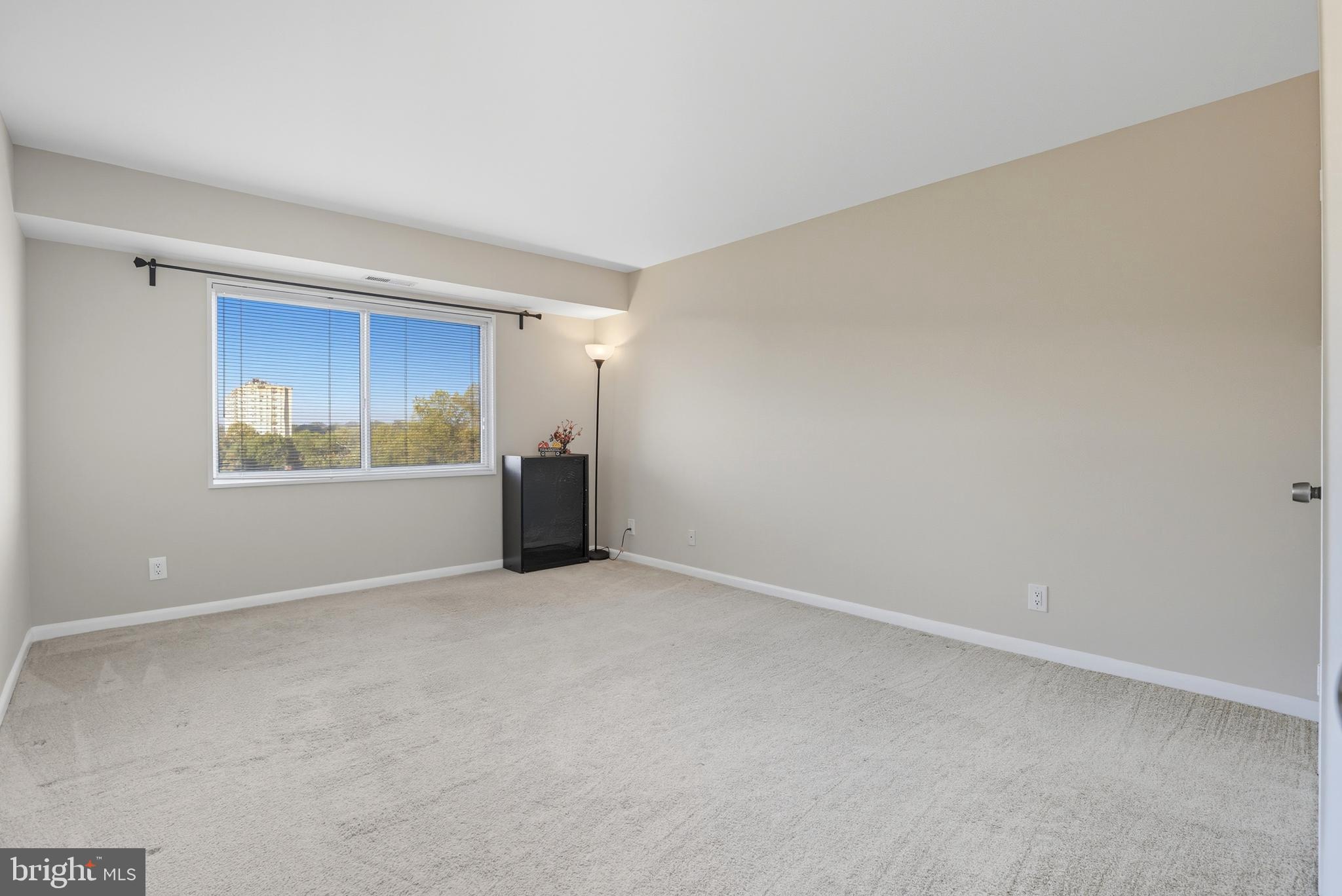 12001 Old Columbia Pike, Unit 508 Silver Spring, MD 20904 - Photo 12 of 22 a view of an empty room with a window