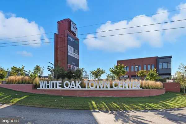 a view of a cars park in front of a building