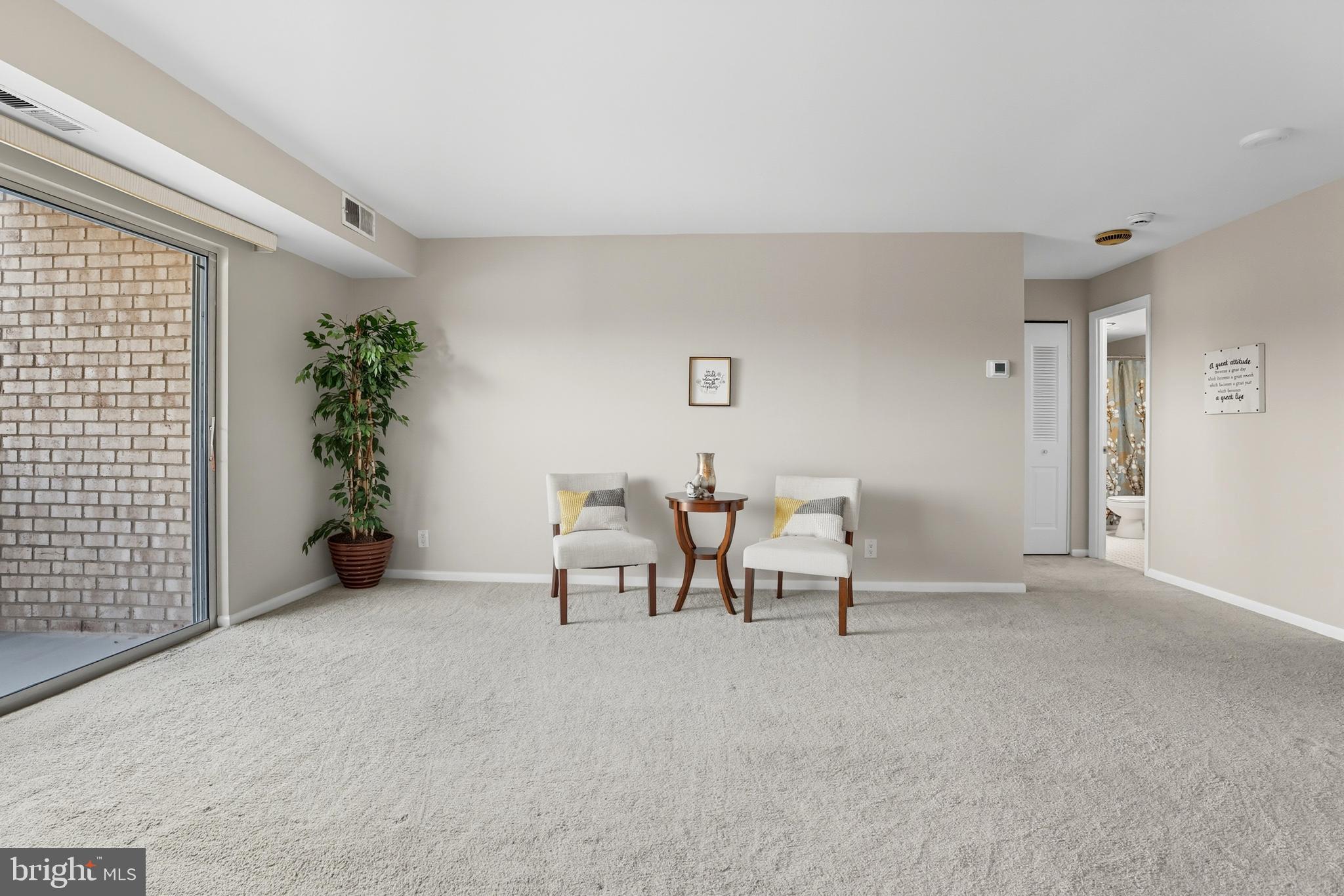 12001 Old Columbia Pike, Unit 508 Silver Spring, MD 20904 - Photo 5 of 22 a view of a livingroom with furniture and a window