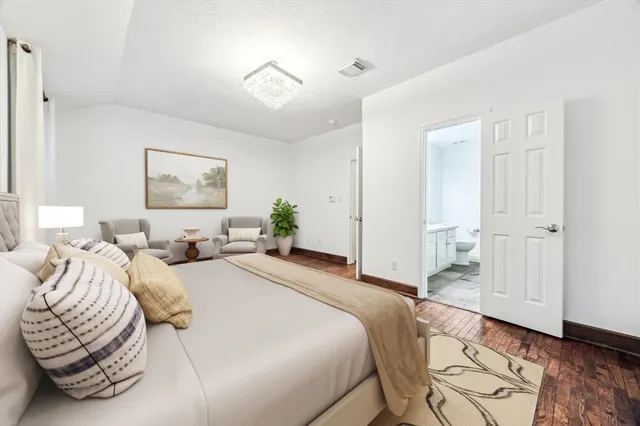 a bedroom with bed and window