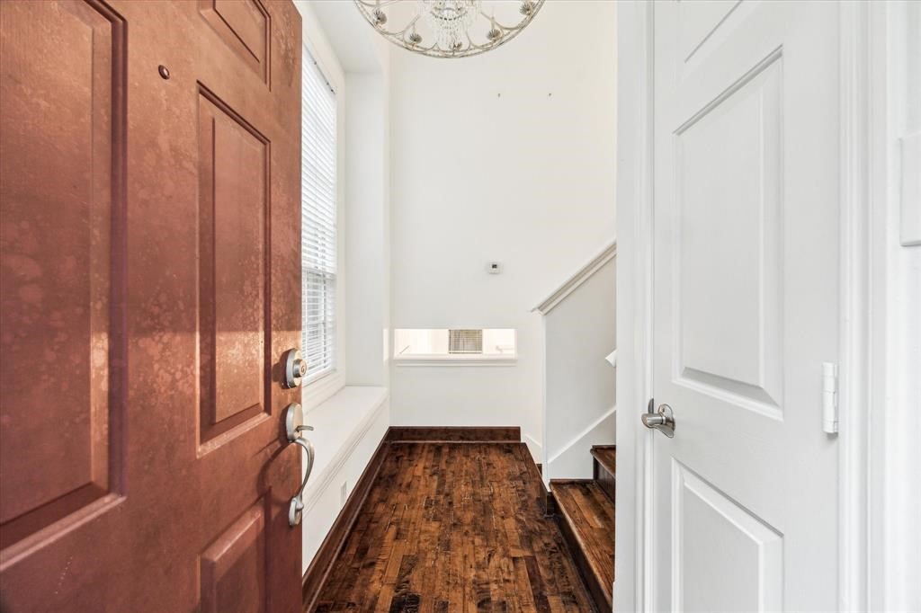 227 Blushwood Place Spring, TX 77382 - Photo 5 of 30 Welcoming entry with rich hardwood floors, large window seat, and staircase leading to the main living area—filled with natural light and charm.
Decked backyard.