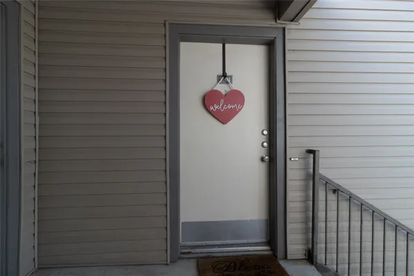a view of a door and wooden floor