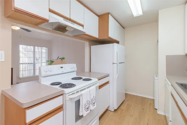 a kitchen with a stove a refrigerator and a stove