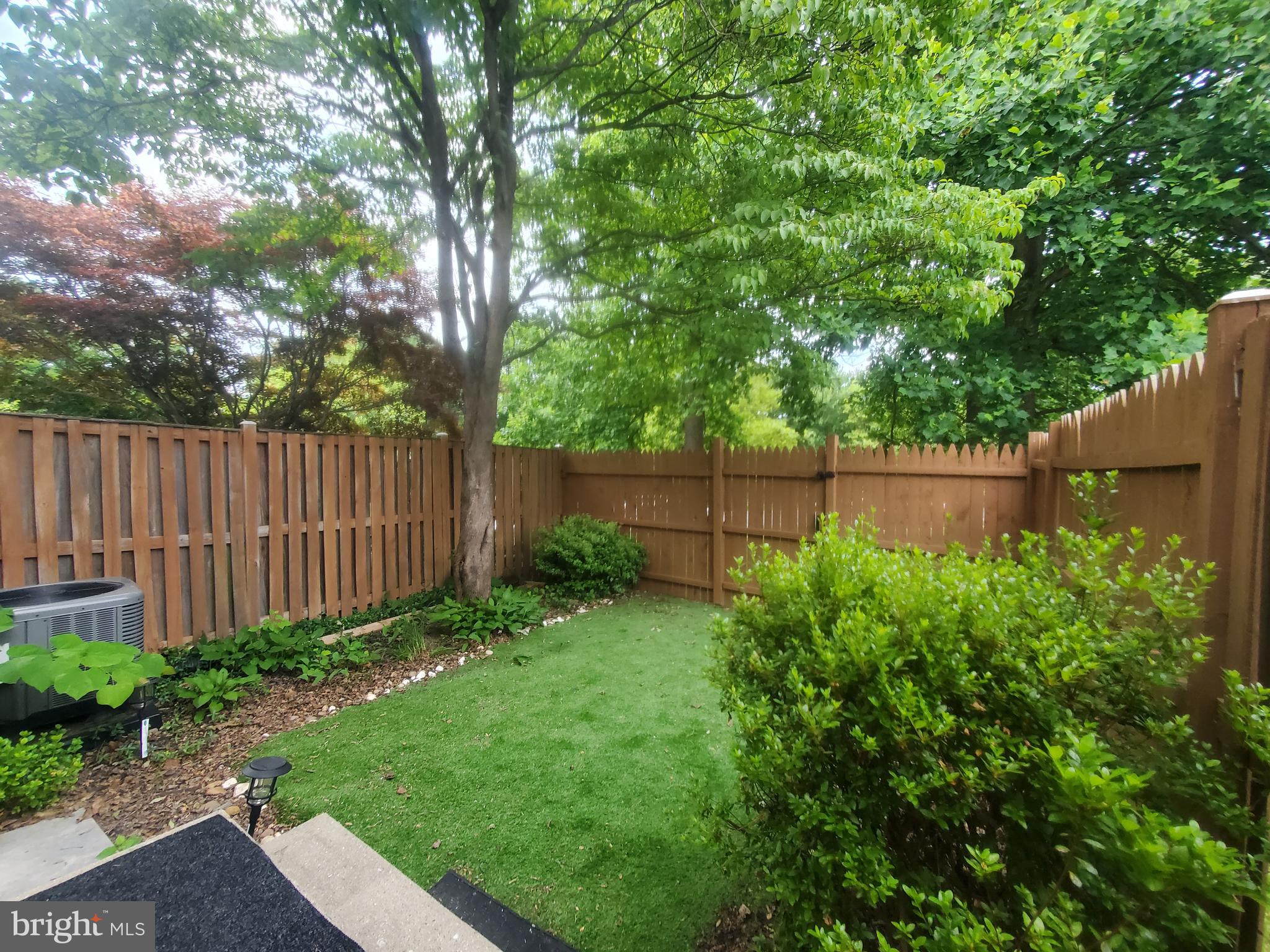 14813 Hammersmith Circle Silver Spring, MD 20906 - Photo 35 of 36 a view of a backyard with a plants and trees