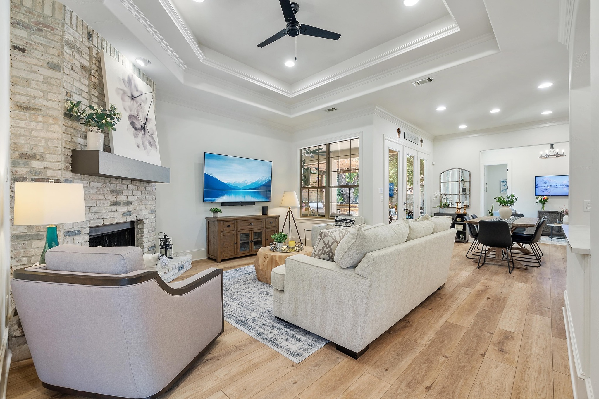 7 Sunview Road The Hills, TX 78738 - Photo 6 of 40 a living room with furniture and a fireplace