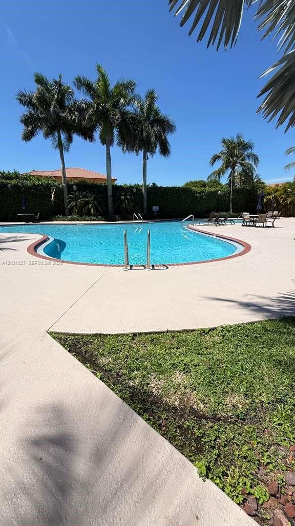 2120 Northeast 37th Road, Unit 1 Homestead, FL 33033 - Photo 2 of 30 a view of a swimming pool and a yard