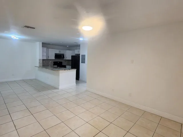 a view of a electric appliances and cabinets