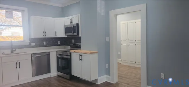 a bathroom with a sink toilet and mirror
